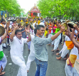 Devotees celebrate the Rath Yatra as they pull Lord Jagannath's chariot near Tyagraj Stadium in New Delhi on Wednesday. 