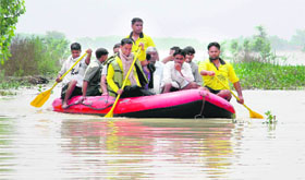 Villagers rescued by Jal Police personnel from submerged areas in the rural Lakshar area of Haridwar on Wednesday