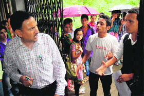 Students argue with the Regional Manager, HPRTC, at Dharamsala on Wednesday