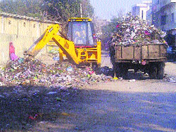 Garbage being lifted from a dump on the old post office road in Phagwara. 
