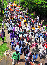 Hundreds of devotees pull the chariot during a rath yatra in Jammu on Wednesday