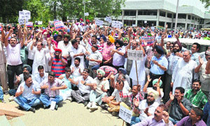 Realtors hold a protest in Ludhiana on Wednesday. 