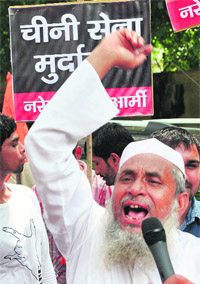 A protester raises anti-China slogans during a protest in New Delhi on Wednesday. 