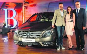 Bollywood actress Aditi Rao Hydari and actor Abhay Deol (L) pose with CEO of Mercedes-Benz India Eberhard Kern at the launch of B Class 180 CDI in Mumbai on Thursday