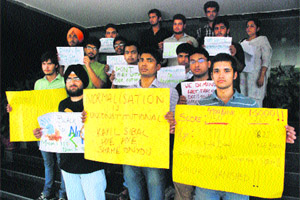 Students hold a protest at the CBSE office in Panchkula on Thursday. 