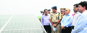KK Sharma , Adviser to the UT Administrator (centre) has a look at the solar panel after its inauguration at the UT Police Headquarters in Sector 9, Chandigarh, on Thursday.