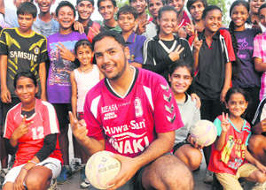 International handball player, Manavpreet Singh Bawa, with budding players in Chandigarh on Thursday.