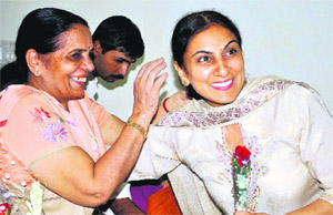 Upinder Walia (right), Panchkula Mayor, greeted by a well-wisher at the Municipal Bhawan, Sector 4, Panchkula, on Thursday.