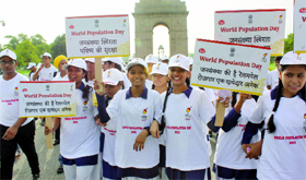 Schoolchildren take part in the Walk towards Population Stabilisation on the occasion of the World Population Day, at India Gate in New Delhi on Thursday.