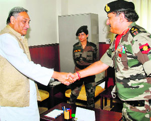 Lt-Gen Rajan Bakshi, new General Officer Commanding-in-Chief of Central Command, meets Chief Minister Vijay Bahuguna in Dehradun on Thursday. 