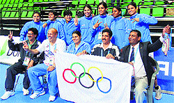 Members of Indian Women Kabaddi Team pose with the International Olympic Committee (IOC) flag after their victory at the 4th Asian Indoor and Martial Arts Games at Incheon in South Korea