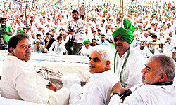 INLD leader Abhey Chautala along with other leaders at a public meeting in Jahangirpur village in Jhajjar
