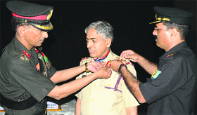 Brig Bonny Mathew performs the piping ceremony at Palampur on Thursday.