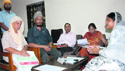 Paramjit Kaur, chairman of the Punjab State Womens Commission, listening to the grievances of a couple in Jalandhar on Thursday. Tribune photo: Malkiat Singh