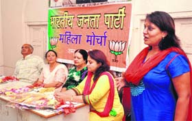 For women power: State in-charge of Jammu and Kashmir BJP Mahila Morcha, Asha Jaswal, national secretary of the Morcha (third from left), attends the meeting of the morchas state office-bearers, district presidents and working committee members at the BJP party headquarters in Jammu on Thursday