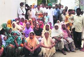 Villagers stage a dharna outside the office of the Jagraon DSP on Wednesday