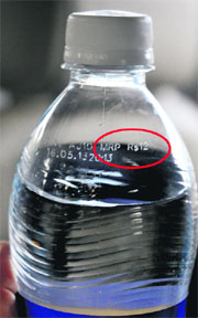 The rate list at one of the taverns of Sector 32 and the MRP of a soda bottle (encircled). 
