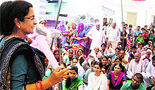 Kiran Choudhry addresses villagers at Rajpura Kharkhari in Bhiwani on Friday