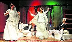 Artistes perform during a play Mukhote at Gaiety Theatre in Shimla on Friday