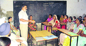Prof Anoop Watts addresses a seminar on World Population Day at an NCLP school in Jalandhar.