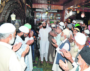 Residents offer first Friday prayers of Ramadan at a mosque in Srinagar during the holy month of Ramadan in Srinagar.