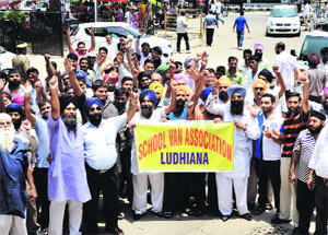 School van operators hold a protest at the mini-secretariat in Ludhiana on Friday. 
