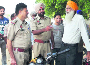 Police officers talk to the deceaseds relatives in Ludhiana on Friday. 