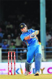 MS Dhoni smashing a six in the last over of the match.