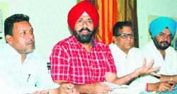 Raj Kanwal Preet Pal Singh Lucky (second from left), Leader of the Opposition in the MC House, addresses mediapersons in Amritsar on Saturday. Photo: Sameet Sehgal