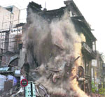 The Land Acquisition Department demolishes century-old shops and residential complexes at Ghee Mandi near Jallianwala Bagh in Amritsar on Saturday. Photo: Vishal Kumar