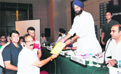 A delegation hands over a memorandum to Cabinet Minister Bikram Majithia in Amritsar on Saturday. A Tribune Photograph 