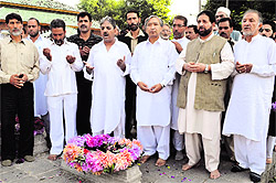 Communist Party of India (Marxist) state committee secretary Mohammed Yousuf Tarigami along with his party leaders offers prayers at the Mazar-e-Shuhada