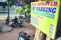 A board installed at a parking site in the Ferozepur Road service lane in Ludhiana. Tribune Photo: Himanshu Mahajan