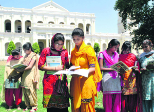 Students look at admission forms at Government Mohindra College in Patiala. 
