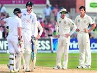 Michael Clarke (2R) and Ashton Agar (R) show their frustration at Stuart Broad (2L) after they unsuccessfully claimed his dismissal during the third day of the first Ashes Test at Trent Bridge in Nottingham