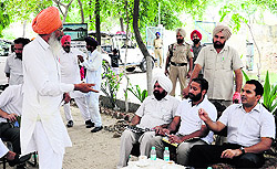 Deputy Commissioner KK Yadav speaks to a person at the awareness camp held on the process of legalising unauthorised colonies in Bathinda on Sunday