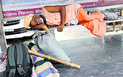 A sadhu takes a nap on a hot Sunday in Bathinda