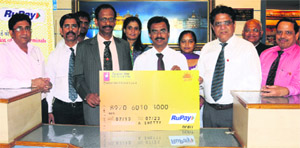 D. Pradeep Naik (third from left), regional manager, Chandigarh region of Vijaya Bank, launches the Rupay branded debit card at Sector 9 in Chandigarh. 