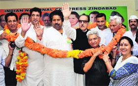 JKPCC chief Saifuddin Soz waves towards party workers during a rally in Jammu on Sunday