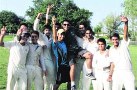Cricketers lift Shubam Khajuria after he was selected in the India under-19 team for the Sri Lanka tour