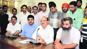 Thakur Kaul Singh, Health and Family Welfare Minister, Himachal Pradesh, addresses the media at the Circuit House in Ludhiana on Sunday.