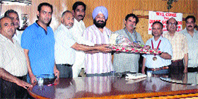 Office-bearers of the Rotary Club, Mandi Ahmedgarh, with former district governor SR Passey.