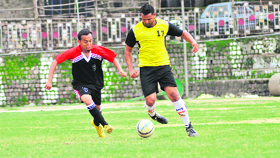 Players vie for ball during the ONGC All India Football Festival at Paddal Ground in Mandi on Sunday.
