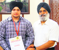 Dildeep Singh (left) and KCGC secretary Rajinder Mohan Singh Chhina pose for a photograph in Amritsar. 