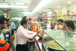 Officials collect samples of nuts and sweets from Anupam Sweets, Sector 11, Panchkula. A file photo