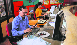 Employees clear pending telegrams at the BSNL office in Sector 17 on Monday. Tribune photo: Manoj Mahajan