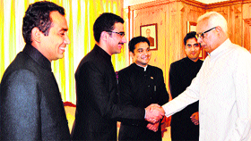One of the IAS probationers shakes hands with Governor NN Vohra while others look on in Srinagar on Monday.