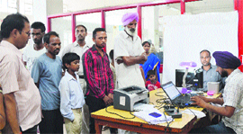 Aadhaar Card enrolment under way at a post office in Ludhiana.