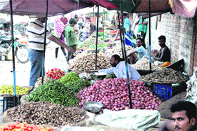 Vegetable vendors at Apani Mandi on Gurunanakpura road in Jalandhar on Monday.
