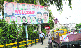 MC tehbazaari wing workers remove illegal political hoardings installed at Ferozepur Road in Ludhiana on Monday.